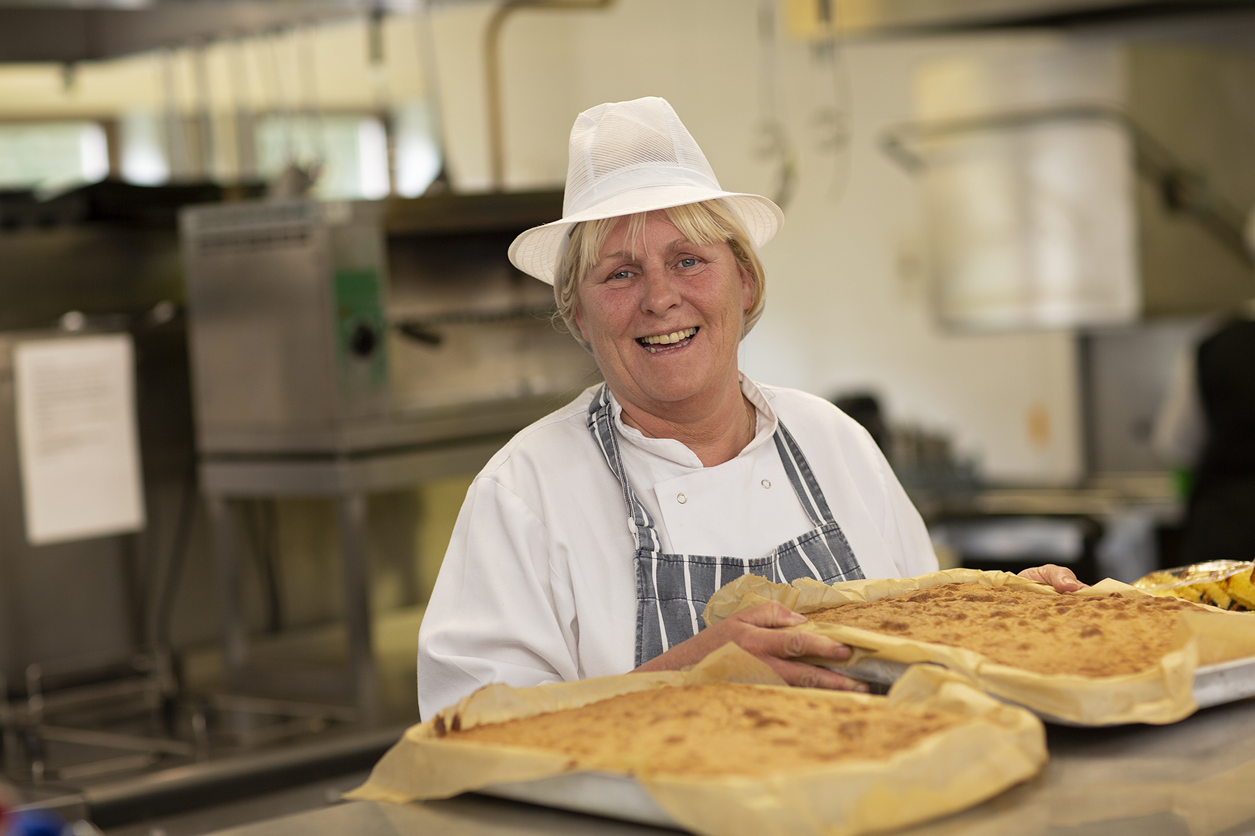 A cook in the kitchen at Brocastle Manor Care Home