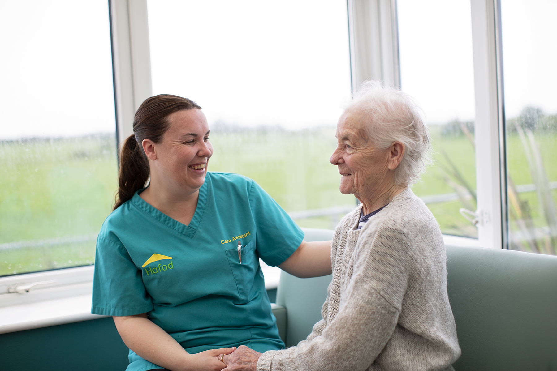 Carer and resident talking at Picton Court Care Home